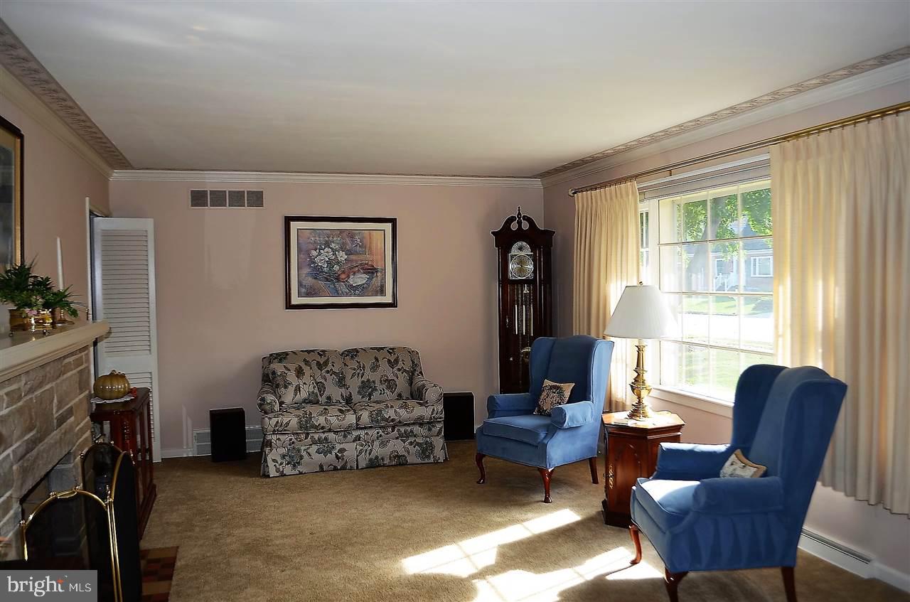 195 West Hoke Street Spring Grove, PA 17362 - Photo 8 of 33 a living room with furniture a large window and a flat screen tv
