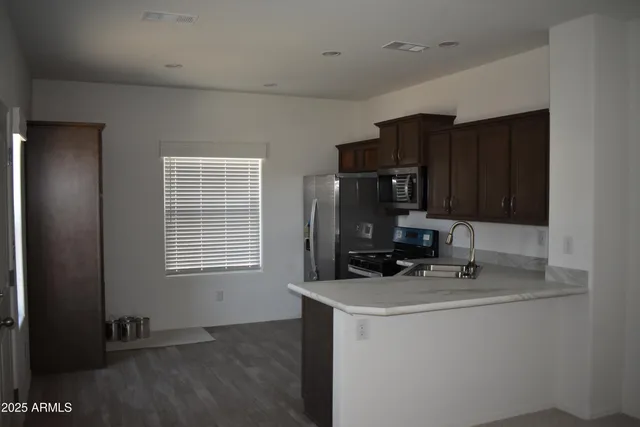 a room with cabinets and appliances