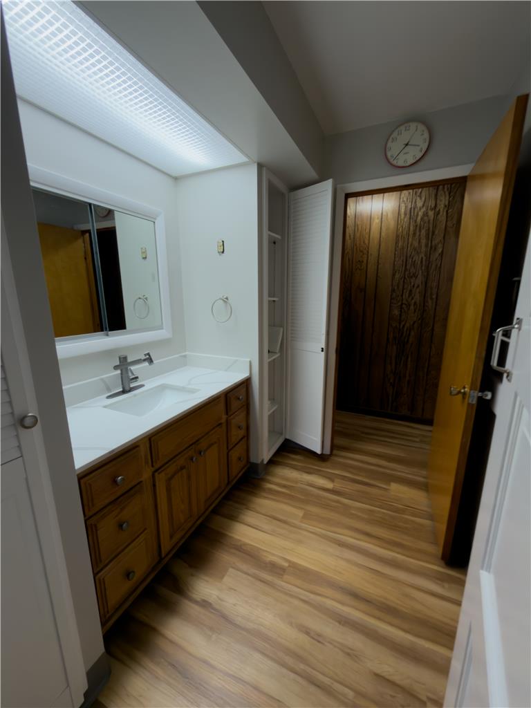 134 Bangor Junction Road Bangor, PA 18013 - Photo 14 of 18 Rich wood floors complement the classic vanity in this thoughtfully laid out bathroom.