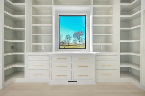 a living room with furniture flat screen tv and a table