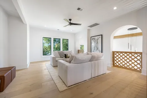 a view of a white house with a yard