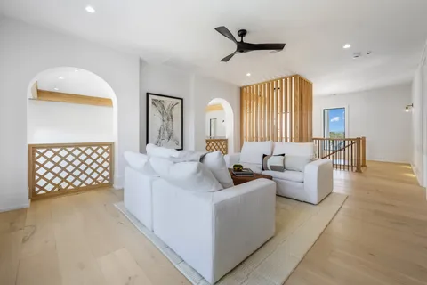 a front view of a house with a yard and outdoor seating