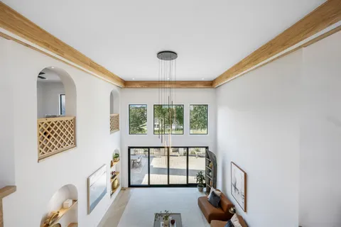 a kitchen with stainless steel appliances granite countertop a refrigerator a stove and a sink with wooden floor