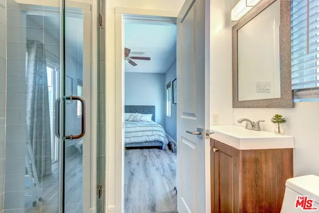 a en suite bathroom with a sink and mirror
