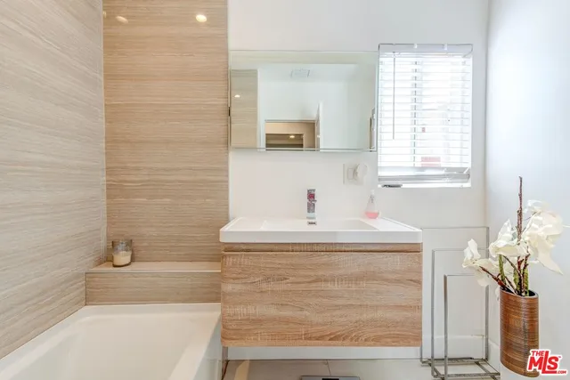 a bathroom with a sink and a bathtub