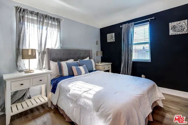 a bedroom with bed and window