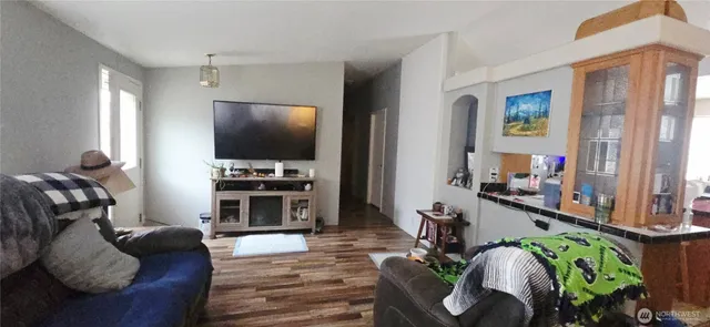 a kitchen with a sink a refrigerator and cabinets