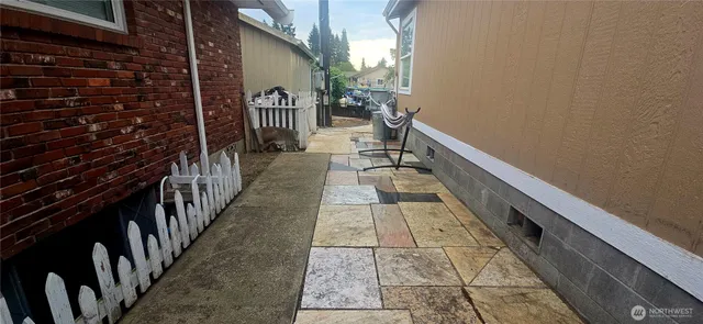 a view of a house with a yard and sitting area