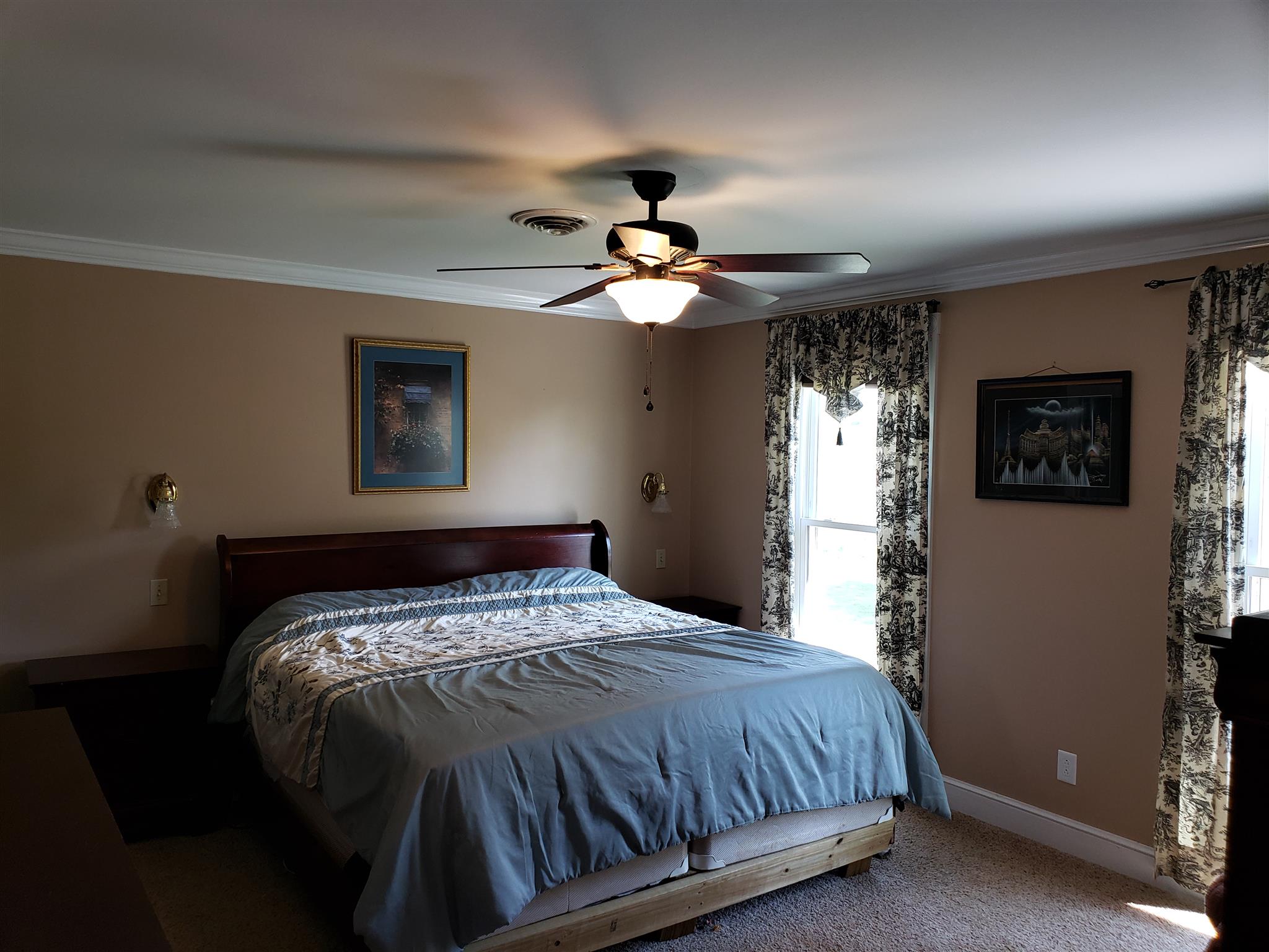 2436 Morrison Viola Road Morrison, TN 37357 - Photo 16 of 28 a bedroom with a bed and a chandelier