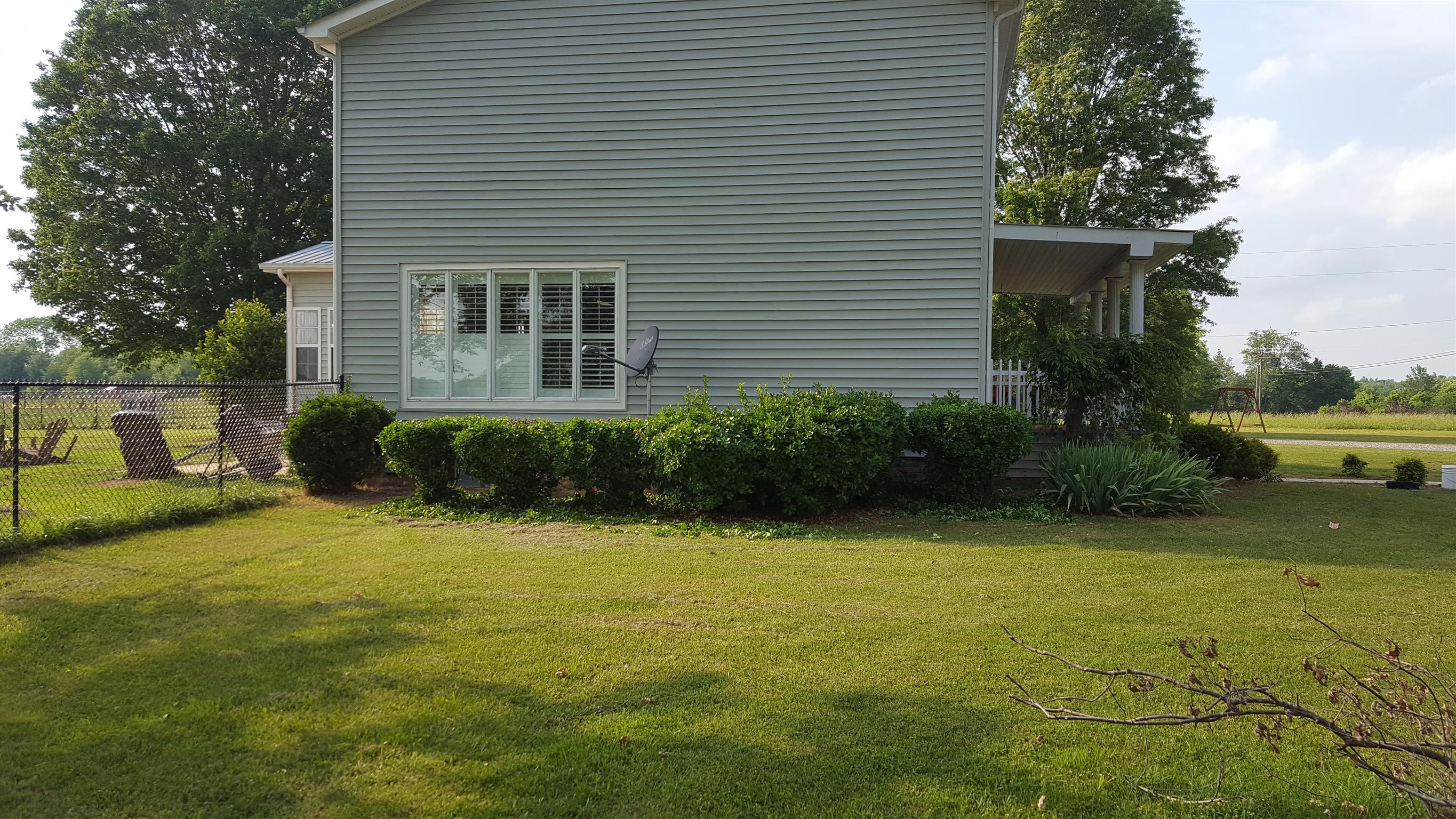 2436 Morrison Viola Road Morrison, TN 37357 - Photo 26 of 28 a view of a backyard with plants and a patio