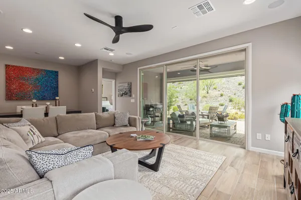 a living room with furniture and a large window