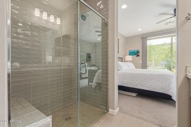 a bathroom with a bathtub and a shower
