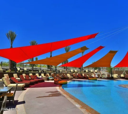 a view of swimming pool with outdoor seating