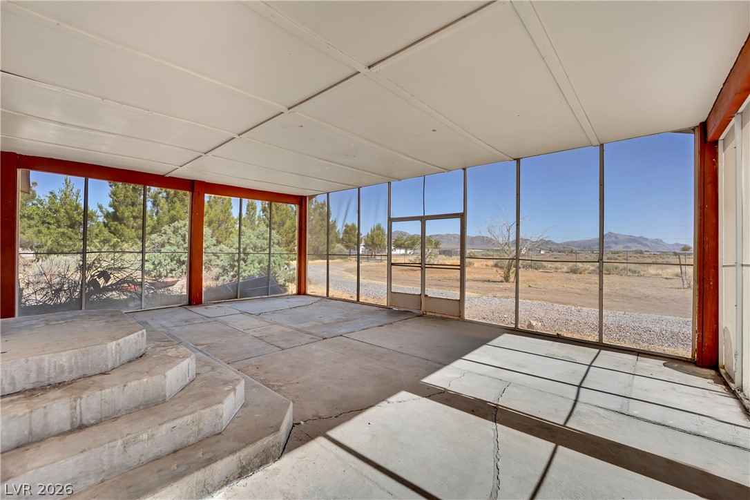 4361 Maple Road Pahrump, NV 89048 - Photo 33 of 46 Enjoy nature's panorama from this spacious, concrete-floored patio, perfect for outdoor living.