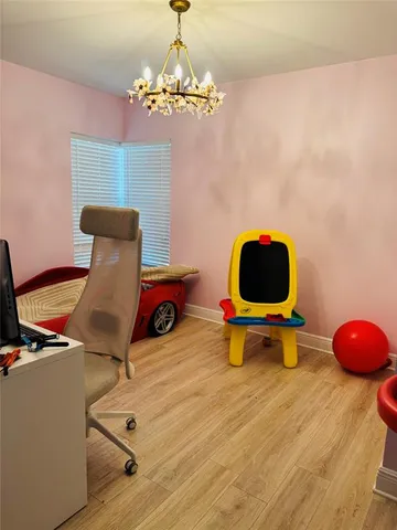 a room with table closet and a chandelier