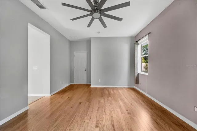 a view of walk in closet with empty racks