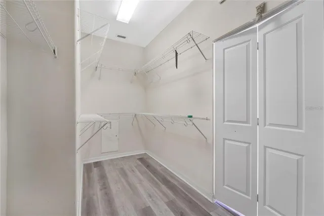 a large bathroom with a large tub shower and sink