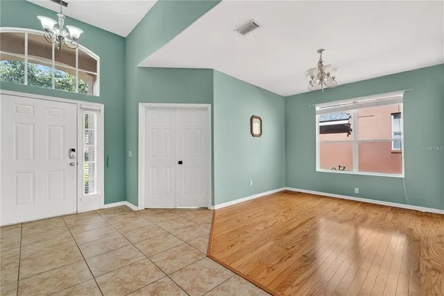 a bedroom with windows and entrance