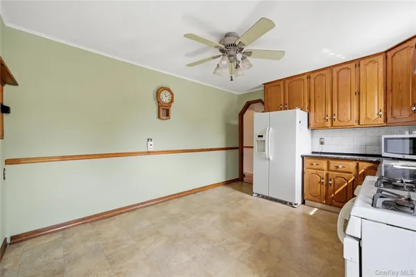 a kitchen with a refrigerator a stove top oven a sink and dishwasher