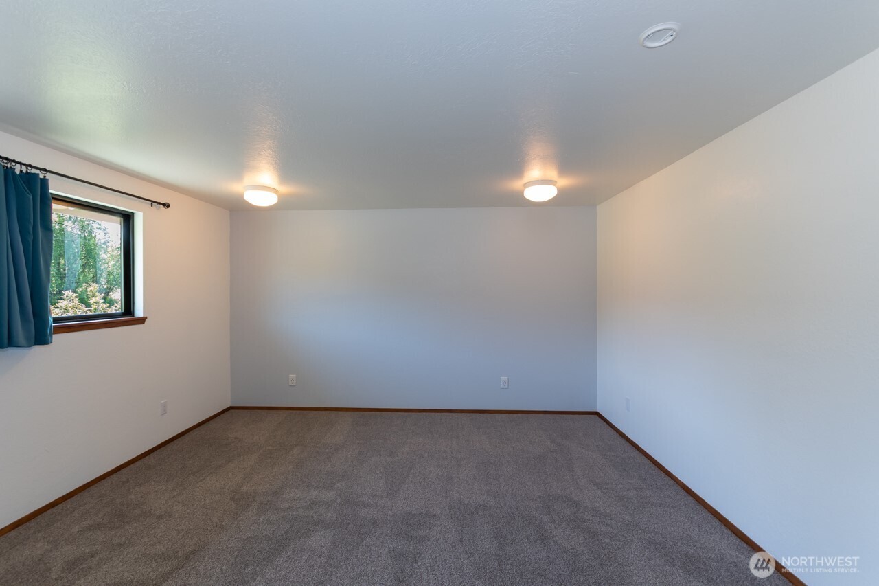 63 East Arnette Road Port Angeles, WA 98362 - Photo 26 of 40 an empty room with a window