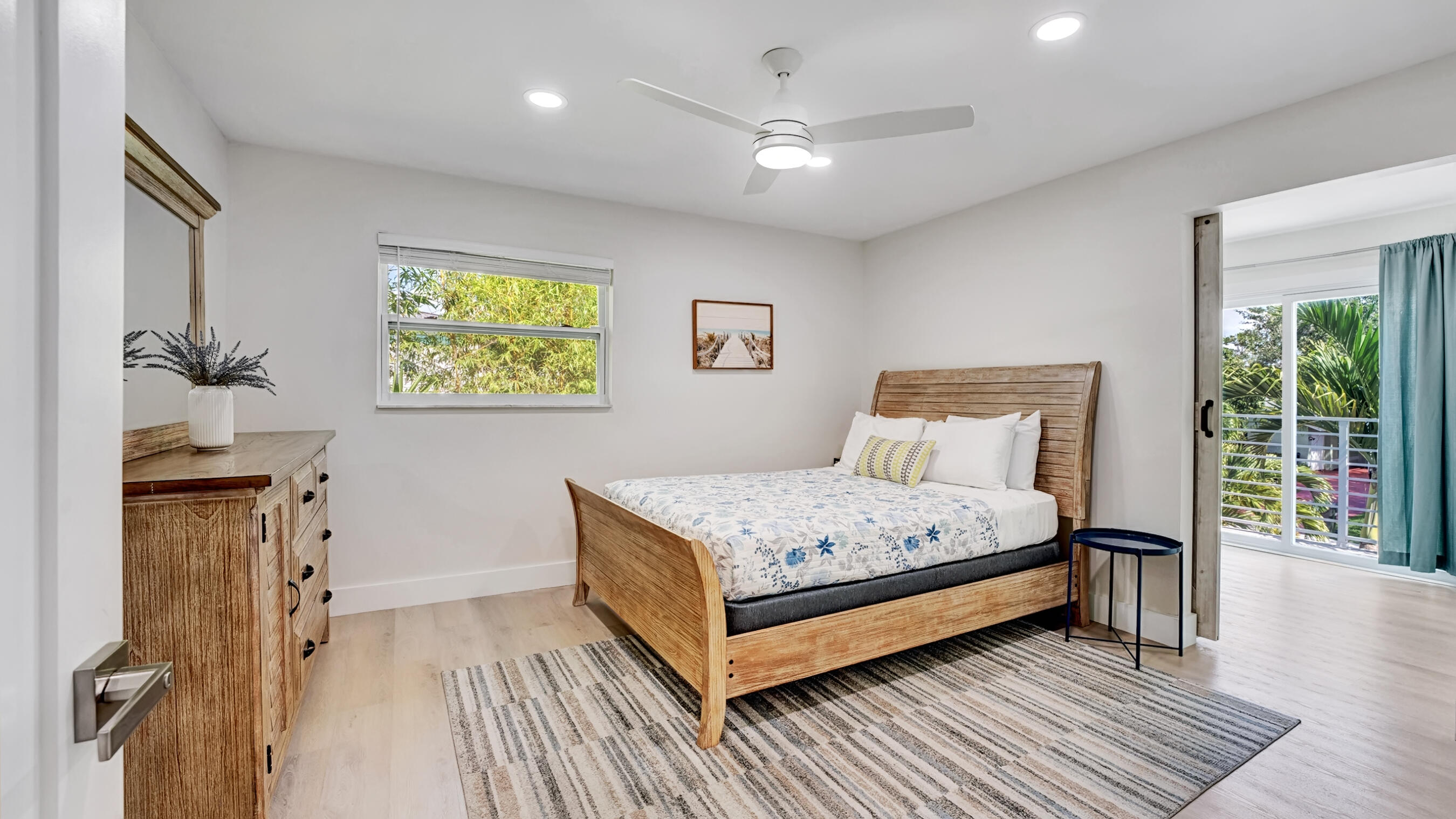 218 Northeast 10th Street Delray Beach, FL 33444 - Photo 15 of 43 a bedroom with a bed and a window