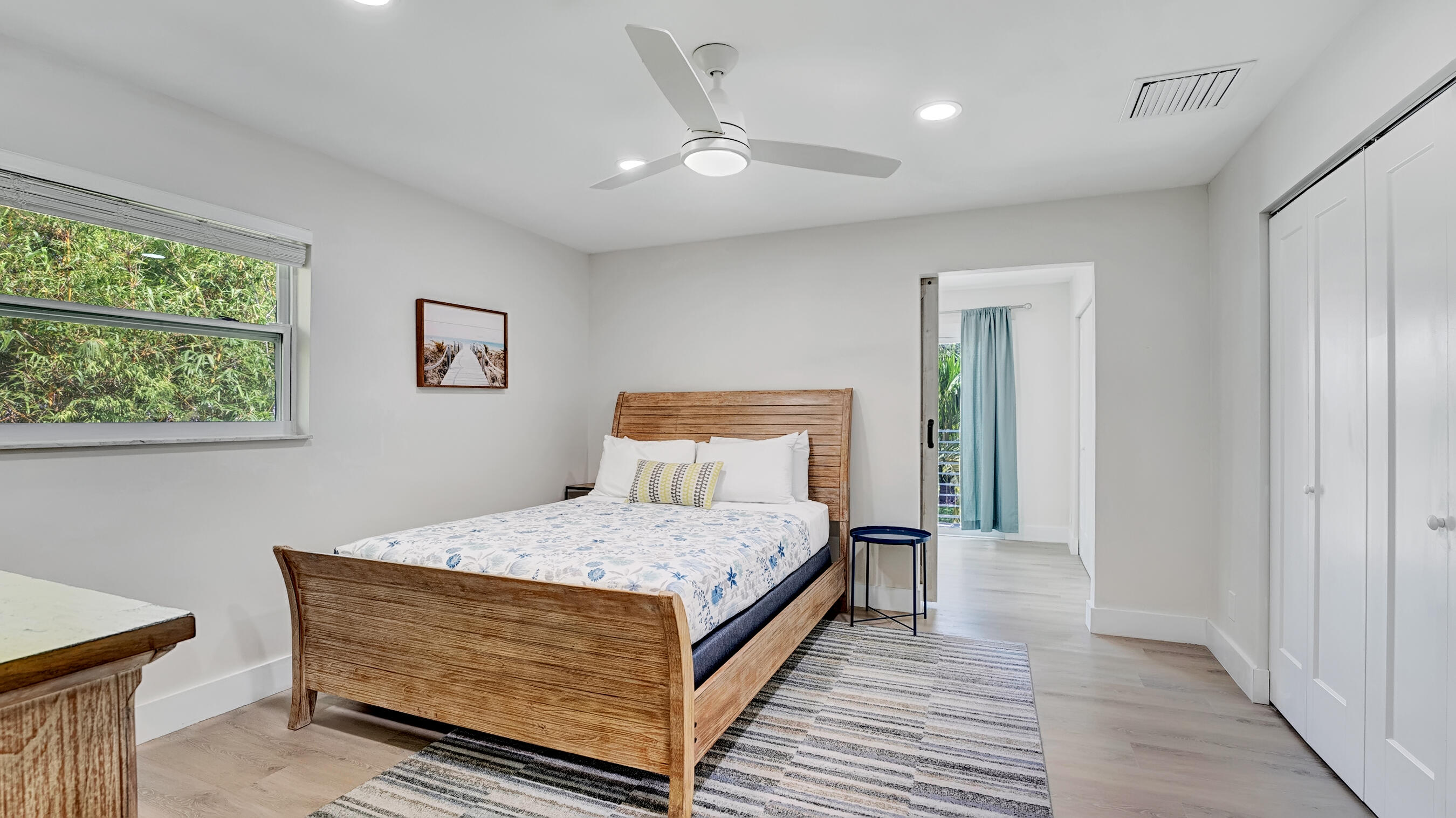 218 Northeast 10th Street Delray Beach, FL 33444 - Photo 16 of 43 a room with a bed and a night stand