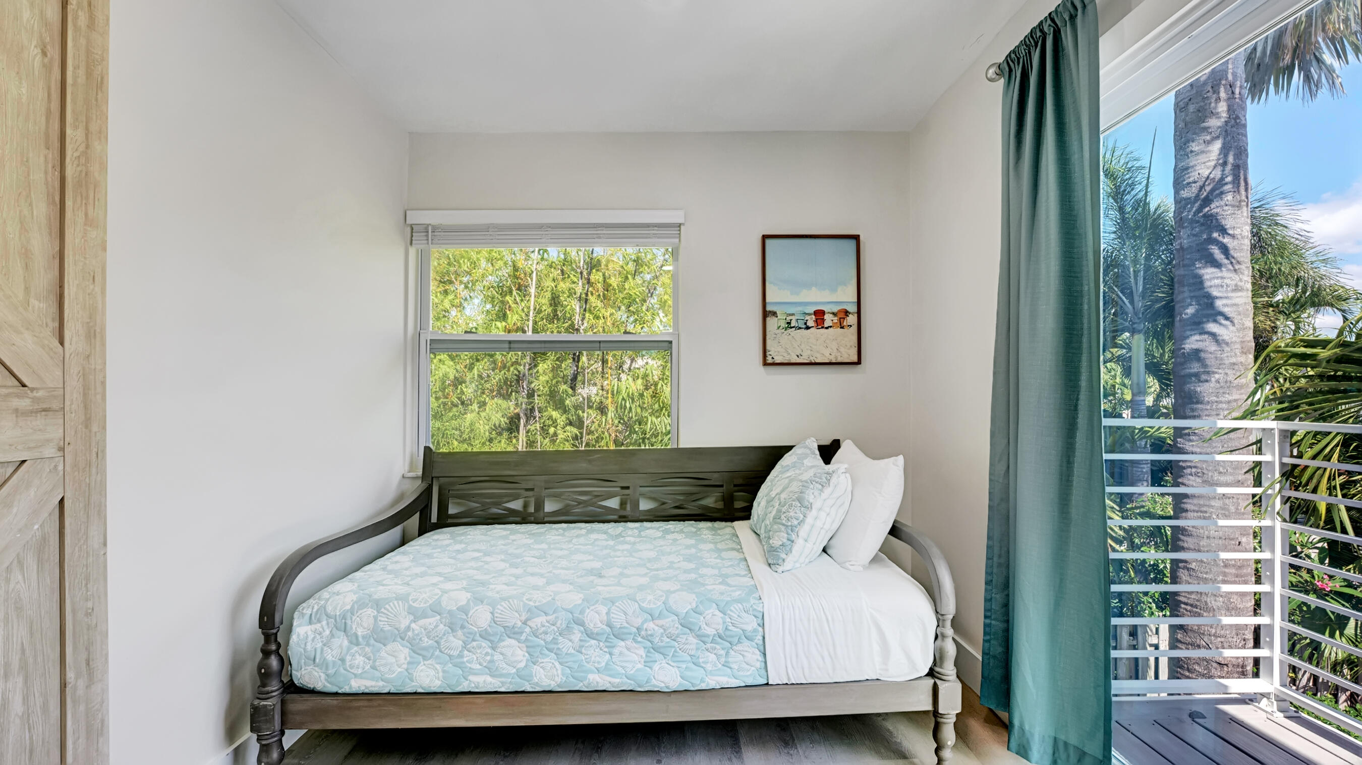 218 Northeast 10th Street Delray Beach, FL 33444 - Photo 18 of 43 a bed sitting in a bedroom next to a window