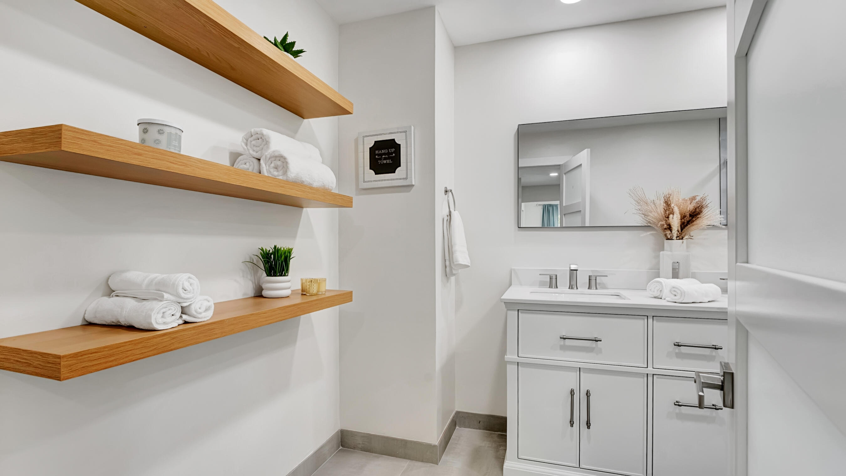 218 Northeast 10th Street Delray Beach, FL 33444 - Photo 20 of 43 a bathroom with a sink and a mirror