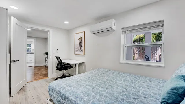 a view of a patio with table and chairs and potted plants