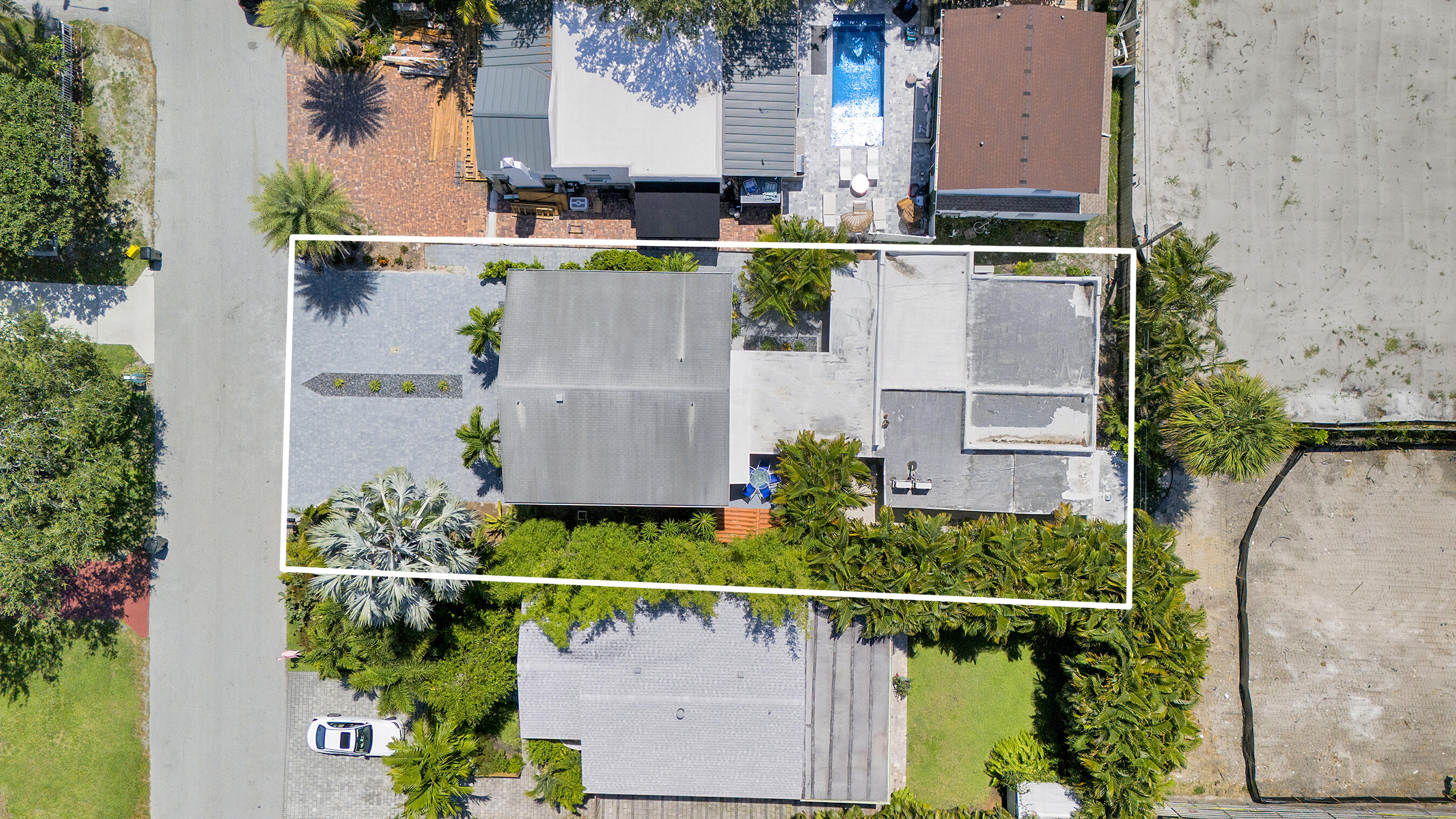 218 Northeast 10th Street Delray Beach, FL 33444 - Photo 41 of 43 an aerial view of a house with a garden and a yard