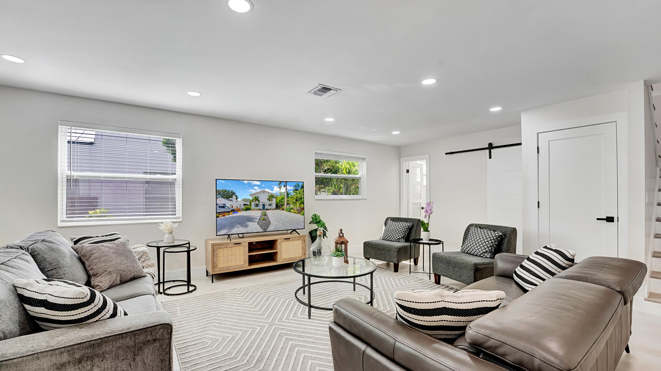 218 Northeast 10th Street Delray Beach, FL 33444 - Photo 6 of 43 a living room with furniture and a flat screen tv