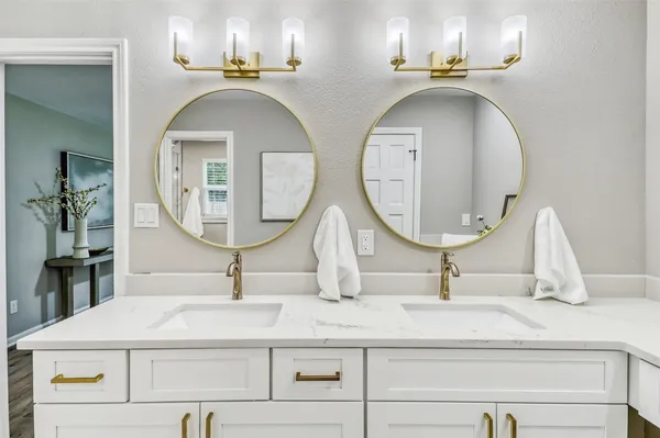 a view of a bathroom with toilet sink and vanity