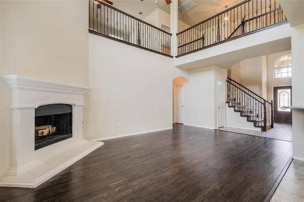 a view of an entryway wooden floor and a fire place