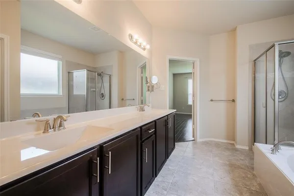 a bathroom with a sink double vanity and a mirror