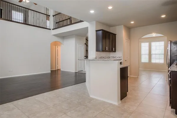 a view of a kitchen cabinets and a wooden floor