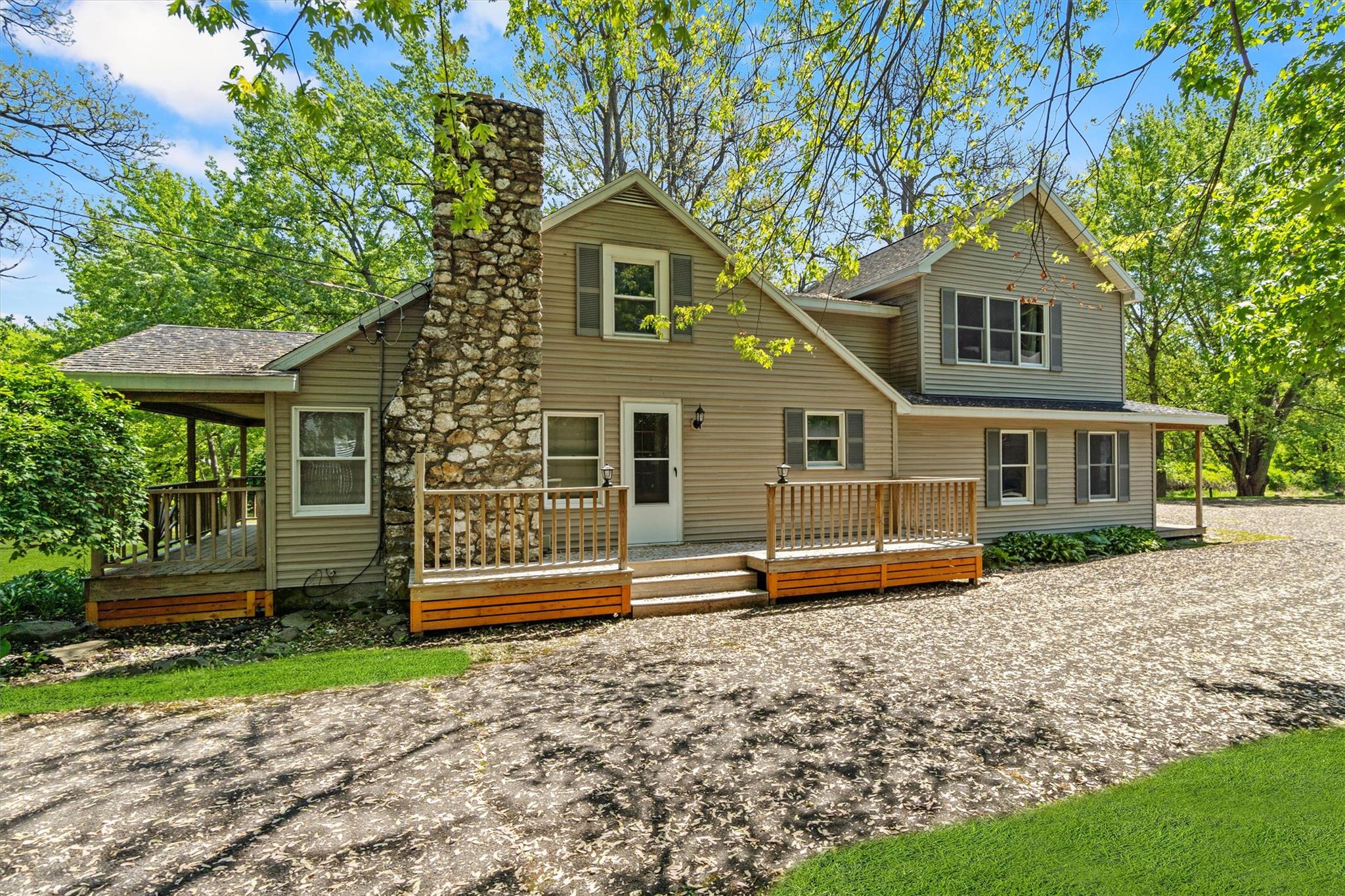 a front view of a house with a yard and a garage