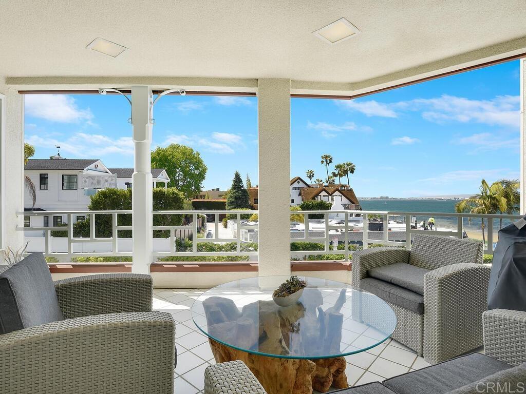 1099 1st Street, Unit 217 Coronado, CA 92118 - Photo 1 of 32 a living room with furniture and a large window