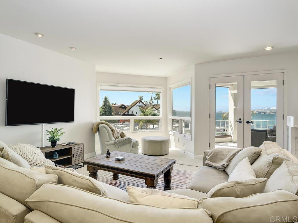 1099 1st Street, Unit 217 Coronado, CA 92118 - Photo 11 of 32 a living room with furniture and a flat screen tv