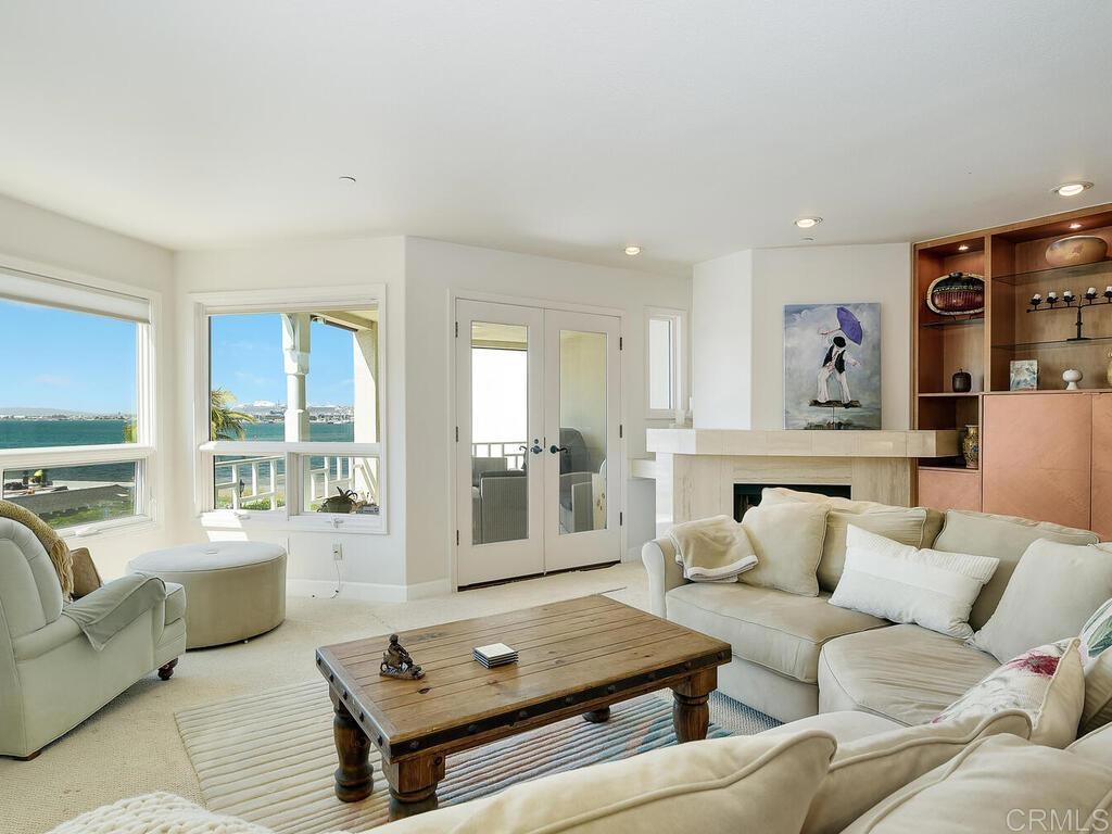 1099 1st Street, Unit 217 Coronado, CA 92118 - Photo 12 of 32 a living room with furniture and a large window