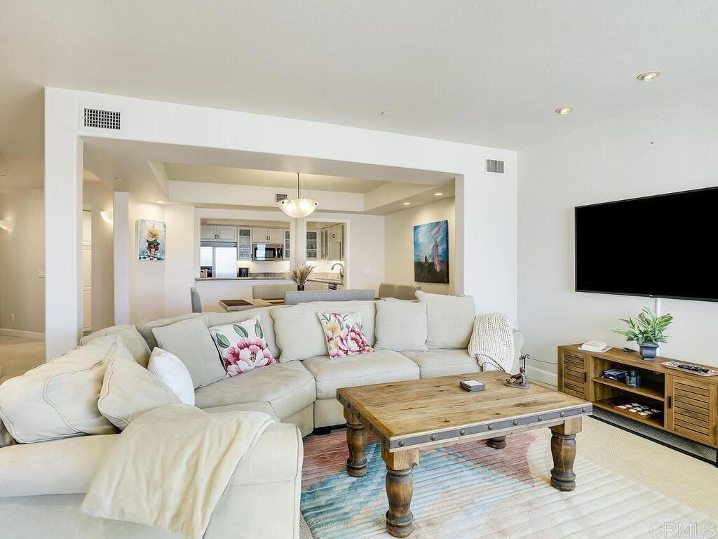 1099 1st Street, Unit 217 Coronado, CA 92118 - Photo 13 of 32 a living room with furniture and a flat screen tv