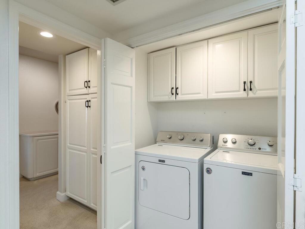 1099 1st Street, Unit 217 Coronado, CA 92118 - Photo 19 of 32 a view of storage and utility room with washer and dryer