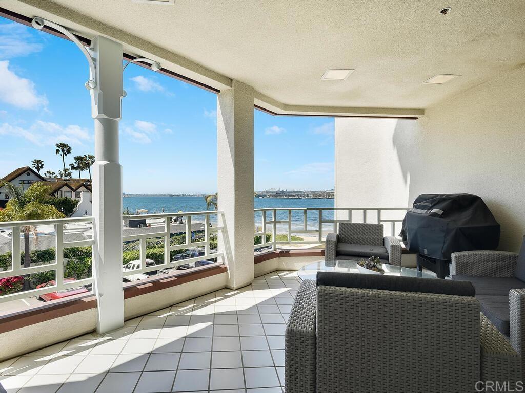 1099 1st Street, Unit 217 Coronado, CA 92118 - Photo 2 of 32 a living room with furniture and a floor to ceiling window