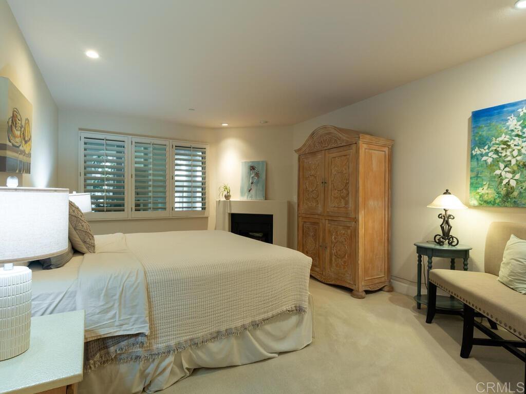 1099 1st Street, Unit 217 Coronado, CA 92118 - Photo 22 of 32 a bedroom with a bed and furniture