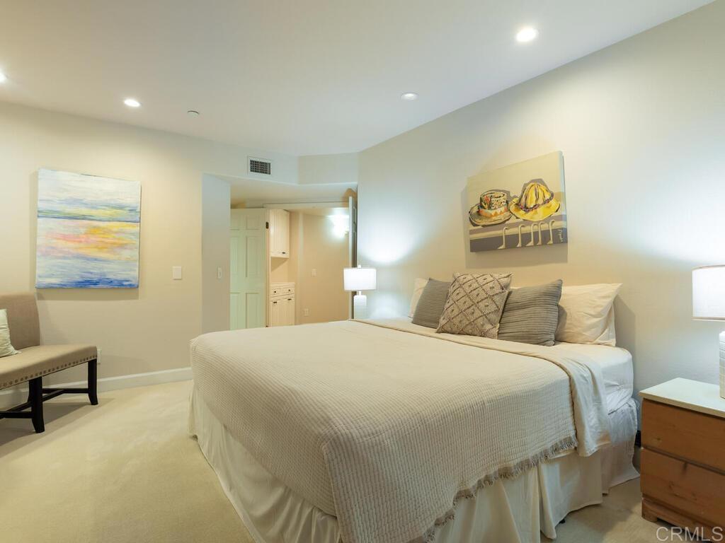 1099 1st Street, Unit 217 Coronado, CA 92118 - Photo 23 of 32 a bedroom with a bed and a table