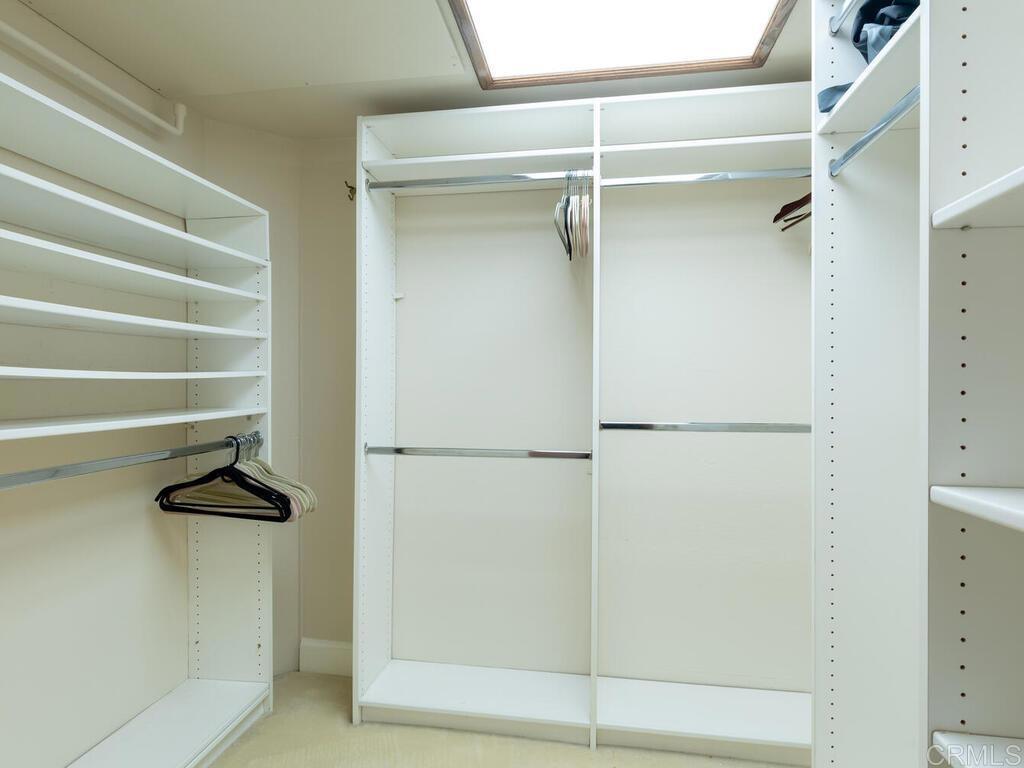 1099 1st Street, Unit 217 Coronado, CA 92118 - Photo 26 of 32 a view of walk in closet with empty racks