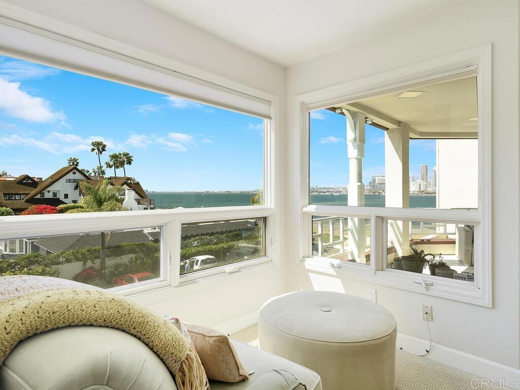 1099 1st Street, Unit 217 Coronado, CA 92118 - Photo 3 of 32 a living room with furniture and a floor to ceiling window