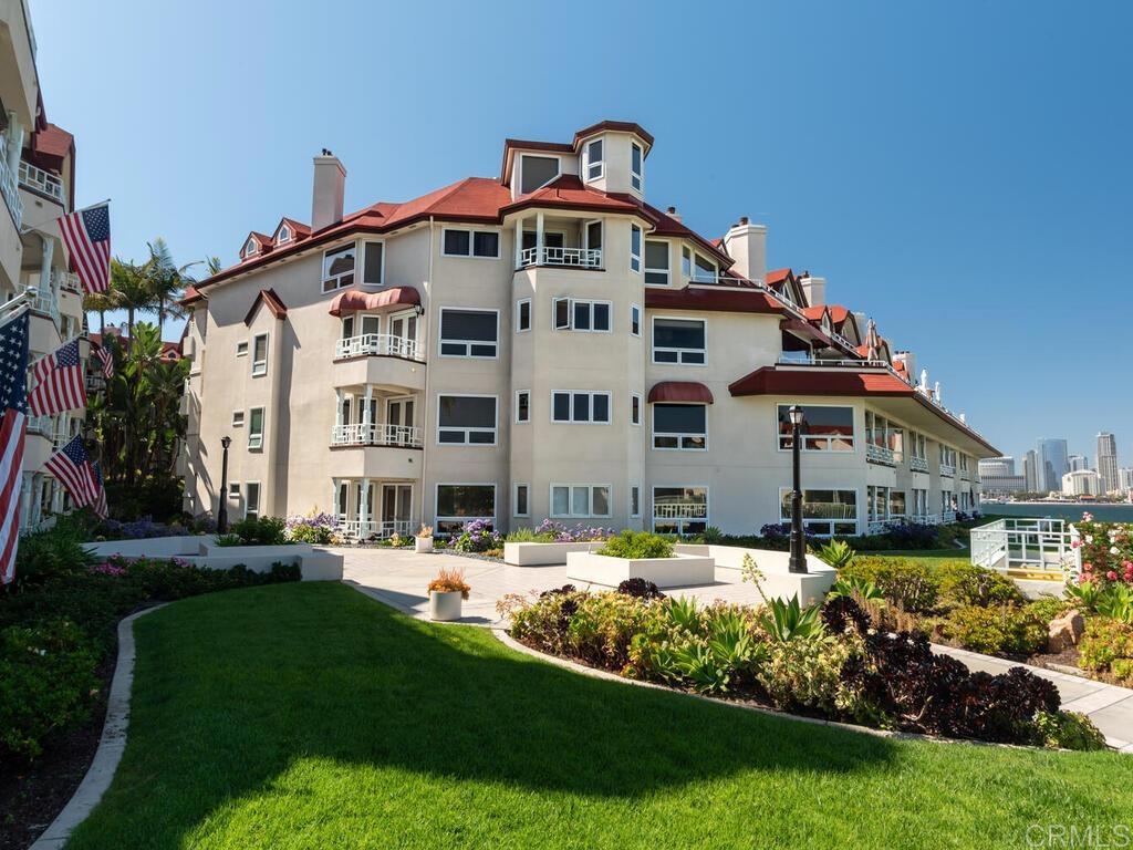 1099 1st Street, Unit 217 Coronado, CA 92118 - Photo 31 of 32 a front view of a house with a yard