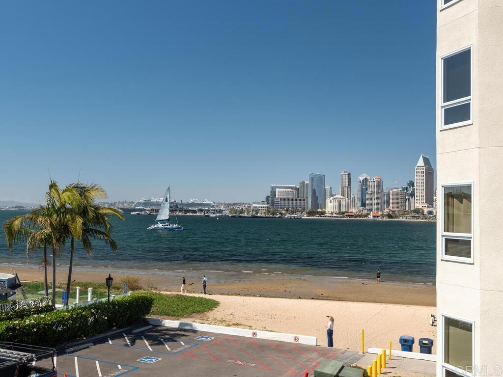 1099 1st Street, Unit 217 Coronado, CA 92118 - Photo 4 of 32 a view of a fountain and a bench in the patio