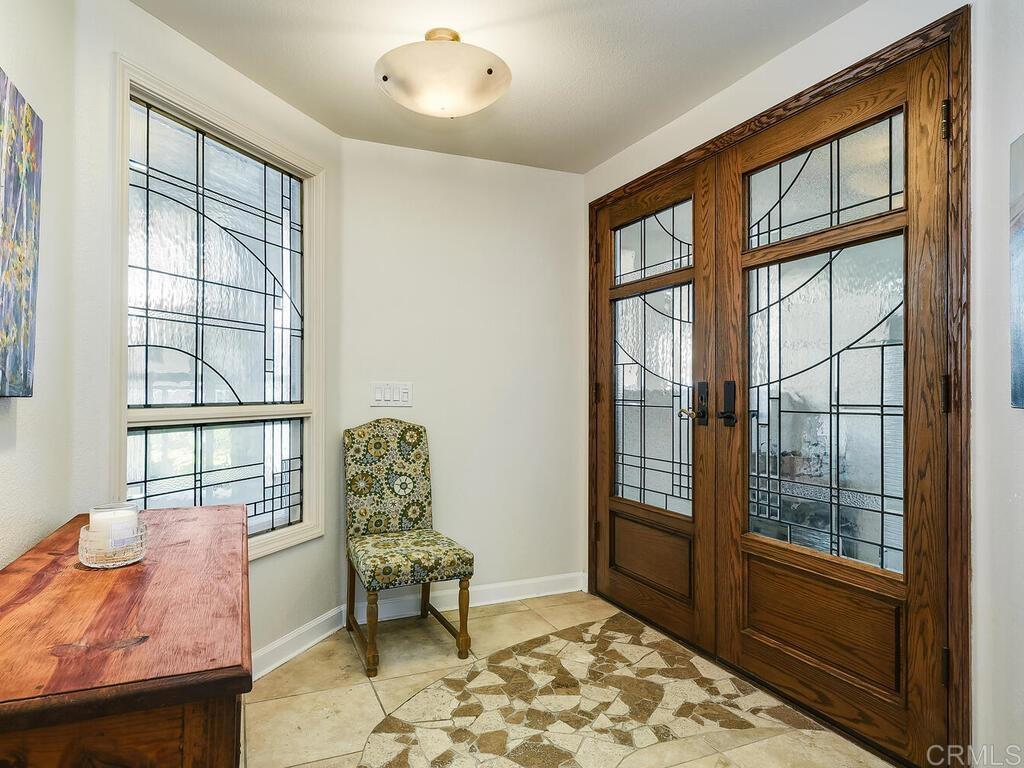 1099 1st Street, Unit 217 Coronado, CA 92118 - Photo 5 of 32 a living room with furniture and a window