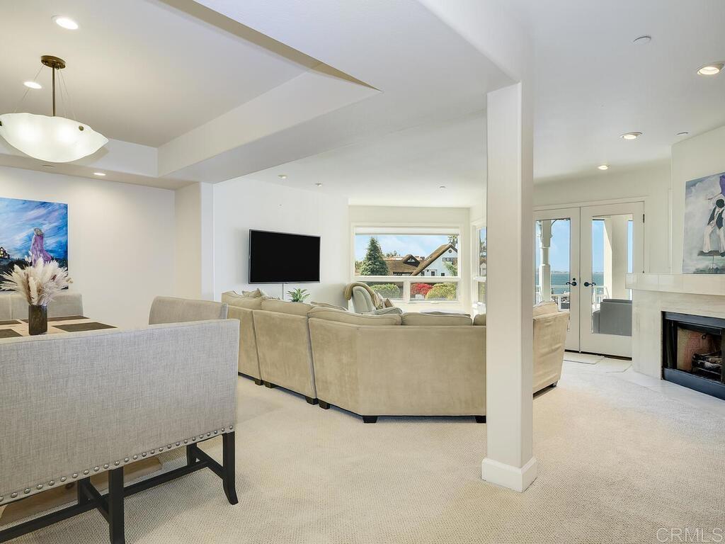 1099 1st Street, Unit 217 Coronado, CA 92118 - Photo 9 of 32 a living room with furniture and a flat screen tv